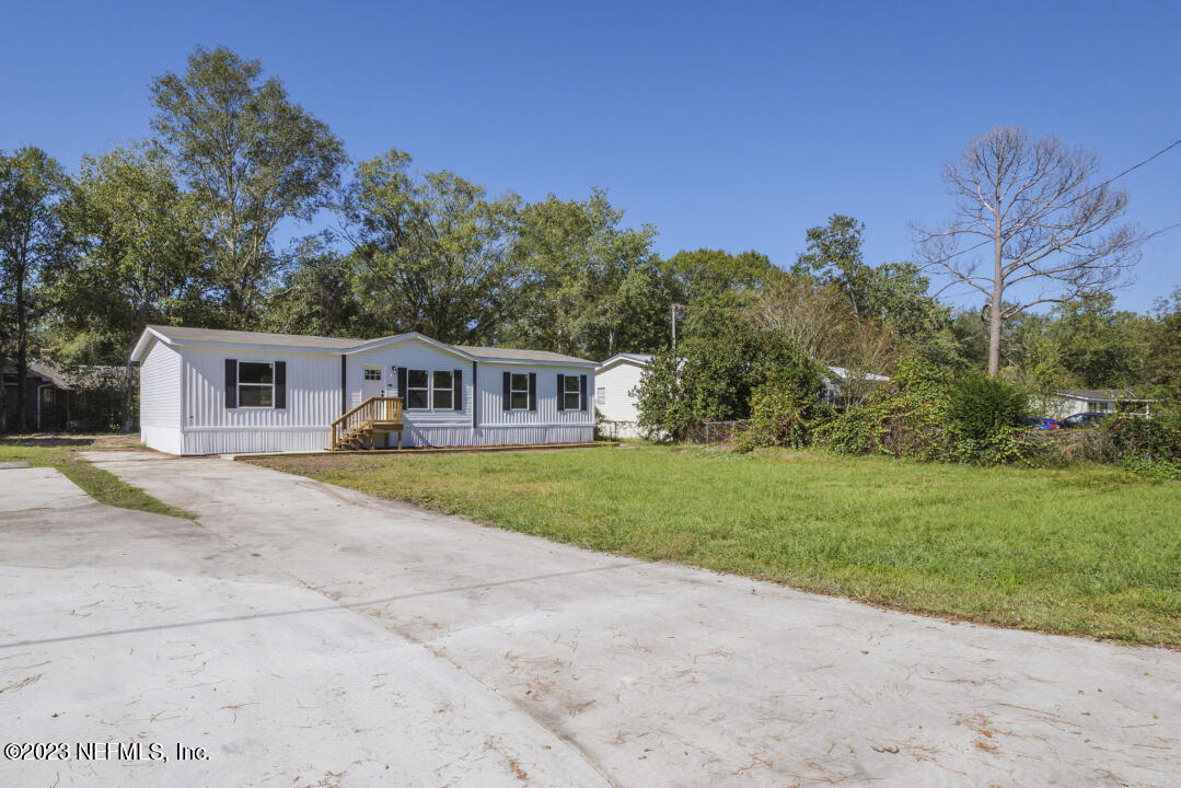 0 Chuck Road Jacksonville, FL 32221 - Photo 2 of 29 a front view of house with yard and green space