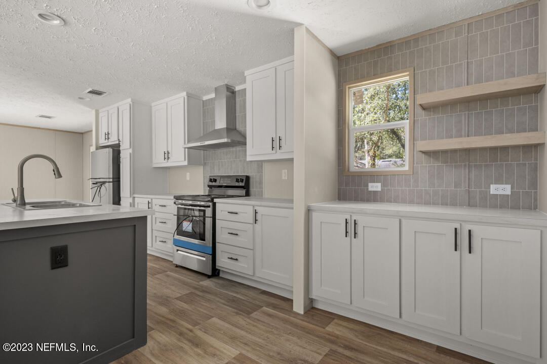 0 Chuck Road Jacksonville, FL 32221 - Photo 8 of 29 a kitchen with cabinets appliances a sink and a window