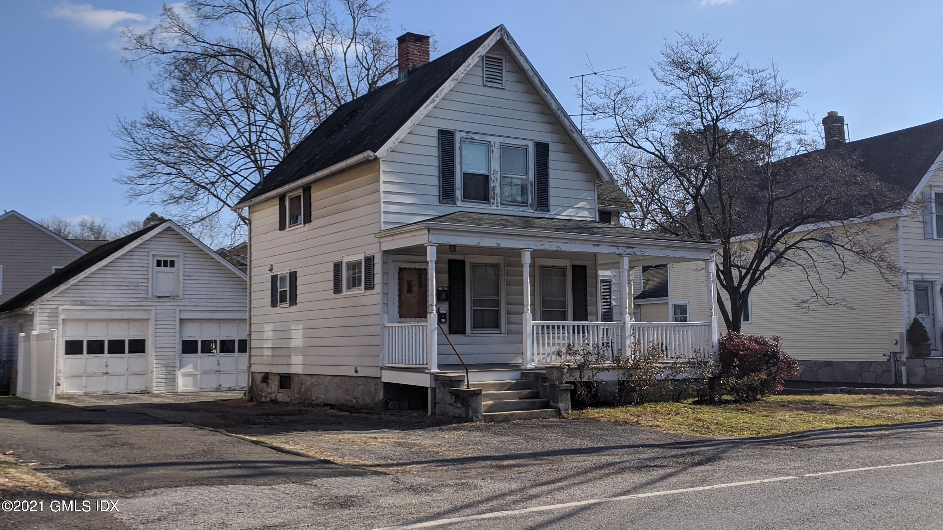 25 Orchard Street Cos Cob, CT 06807 - Photo 1 of 6 a view of a house with a yard