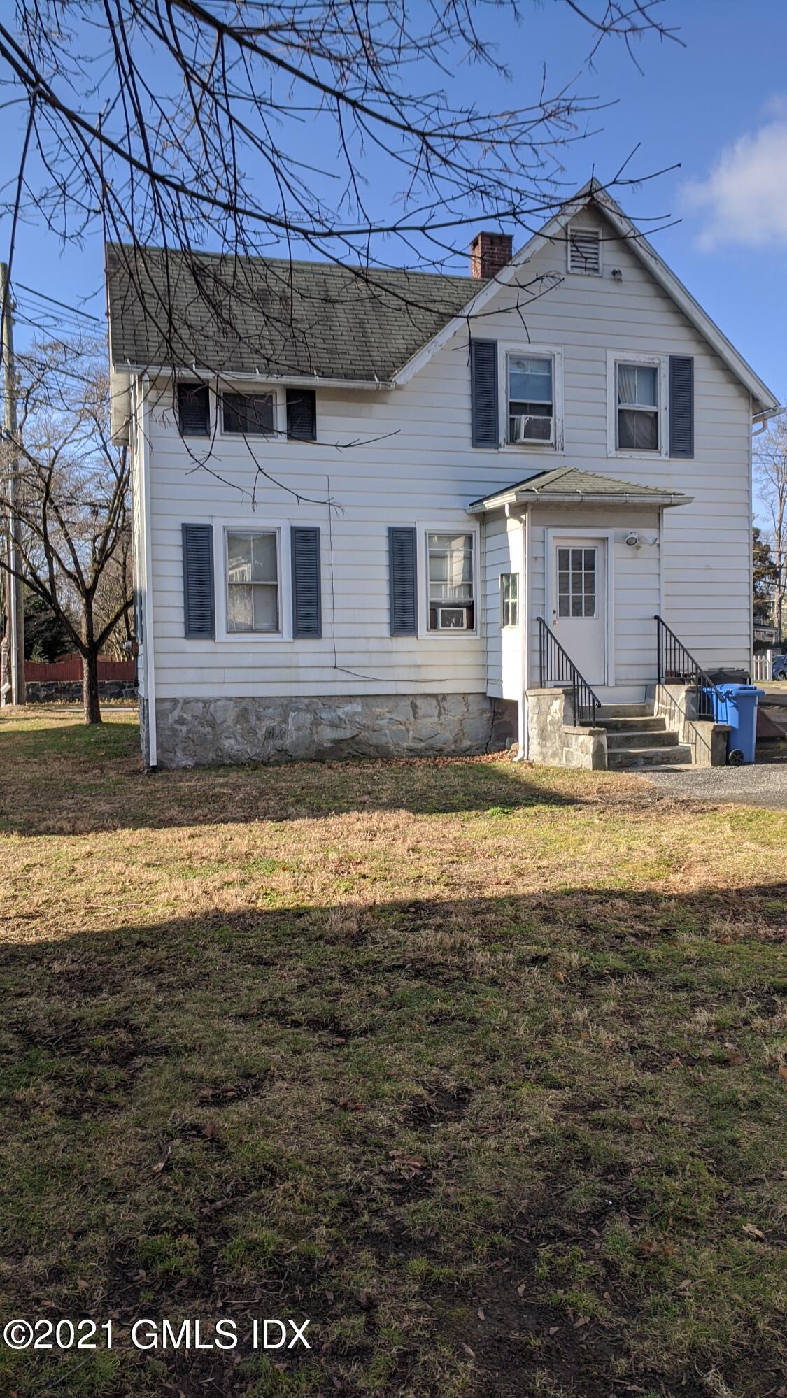 25 Orchard Street Cos Cob, CT 06807 - Photo 2 of 6 a view of a house with a swimming pool