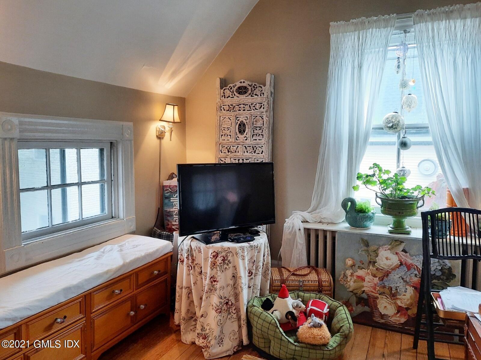 25 Orchard Street Cos Cob, CT 06807 - Photo 6 of 6 a living room with furniture and flat screen tv