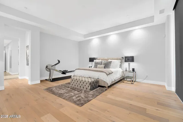 a bedroom with a bed and a dresser