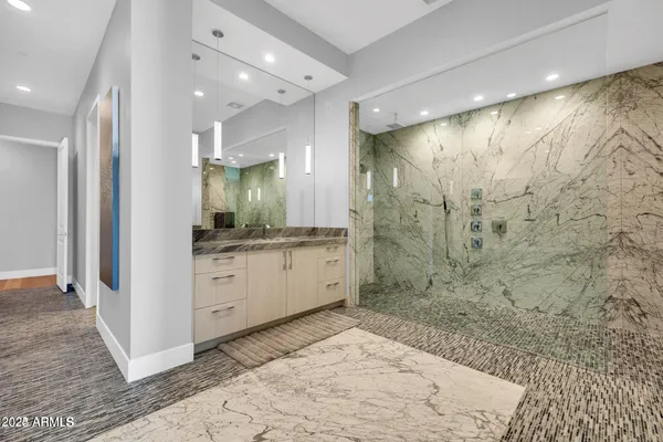 a bathroom with a sink and a mirror