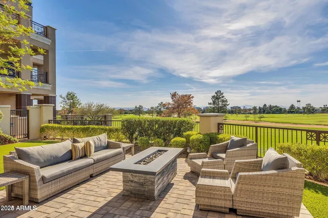 a balcony with furniture and city view