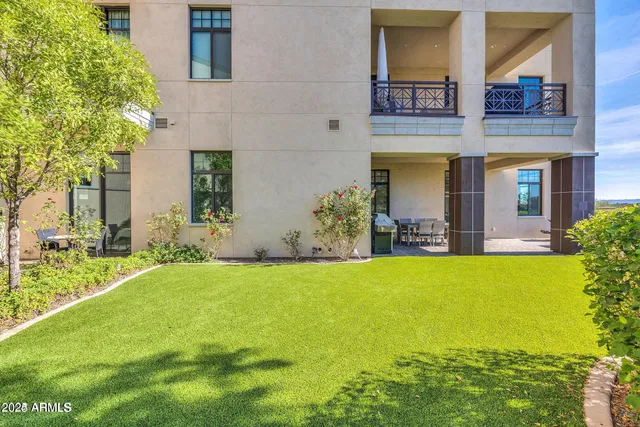 a view of a house with swimming pool and a yard