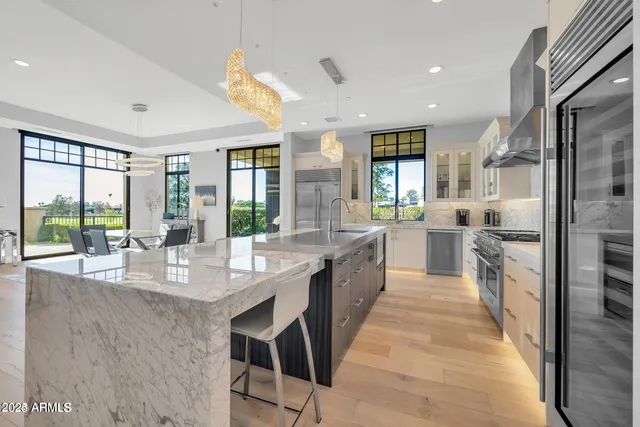 a large kitchen with granite countertop lots of counter top space