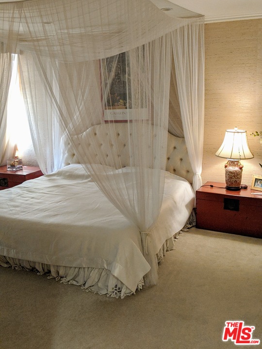 880 West 1st Street, Unit 603 Los Angeles, CA 90012 - Photo 12 of 54 a bedroom with a bed and a window