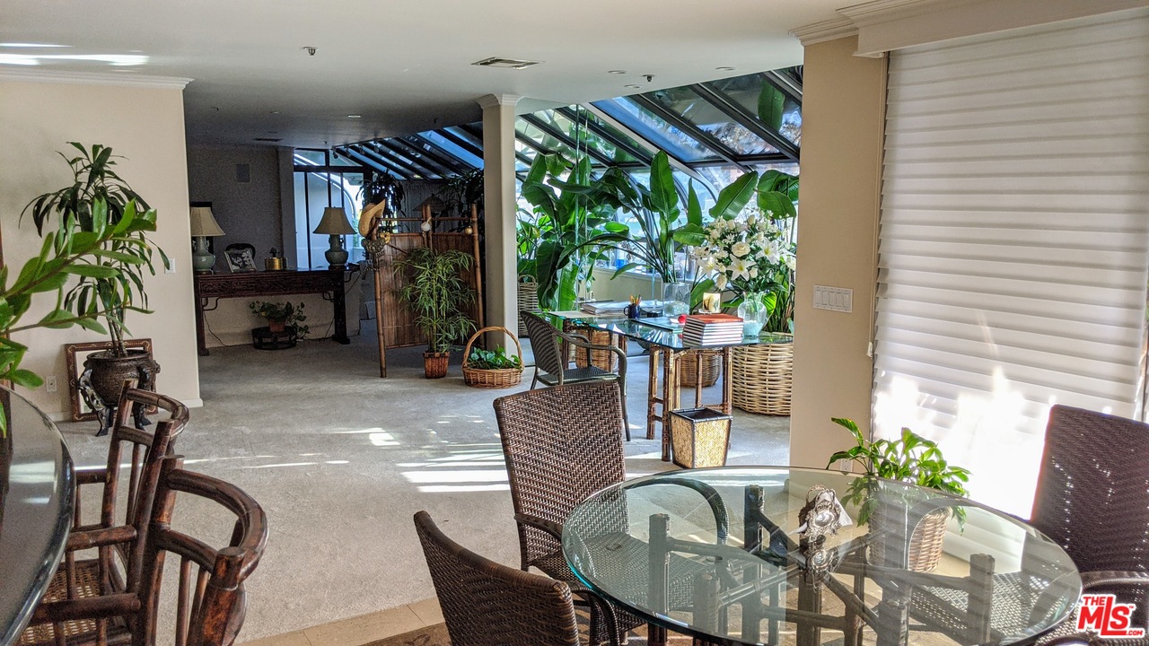 880 West 1st Street, Unit 603 Los Angeles, CA 90012 - Photo 25 of 54 a view of a livingroom with furniture and a potted plant
