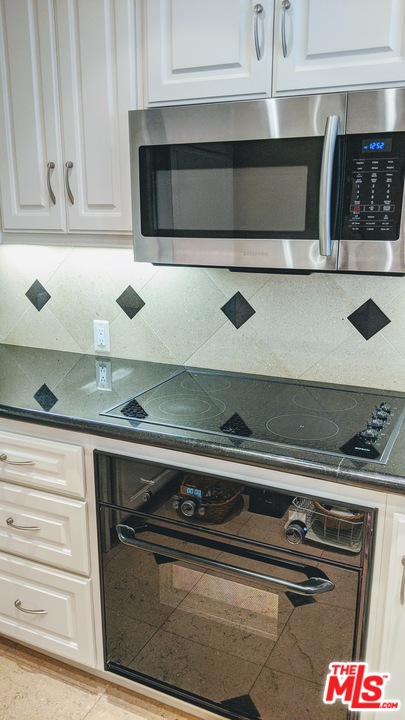 880 West 1st Street, Unit 603 Los Angeles, CA 90012 - Photo 32 of 54 a close view of stove top oven