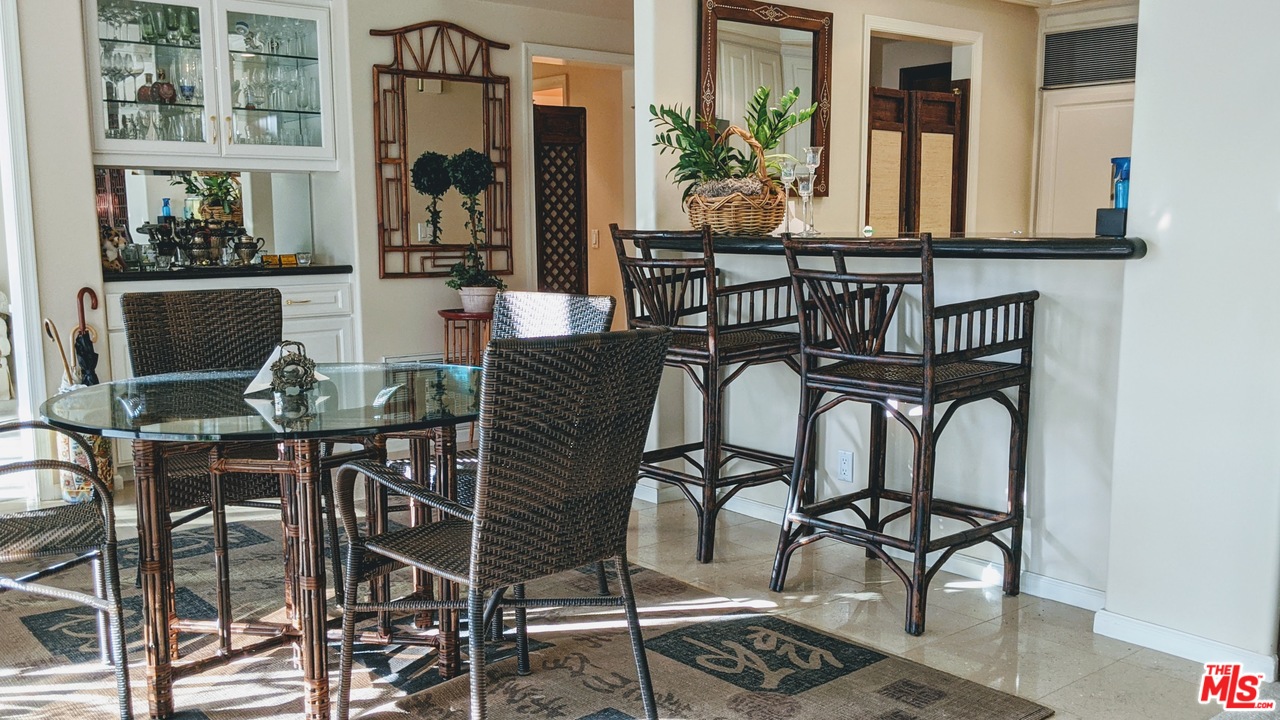 880 West 1st Street, Unit 603 Los Angeles, CA 90012 - Photo 35 of 54 a view of a dining room with furniture and chandelier