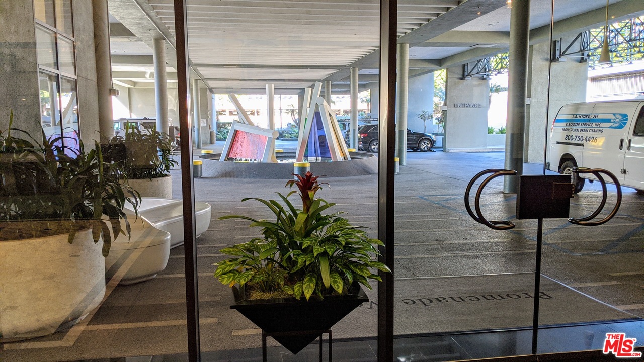 880 West 1st Street, Unit 603 Los Angeles, CA 90012 - Photo 5 of 54 wooden floor with a potted plant on a table