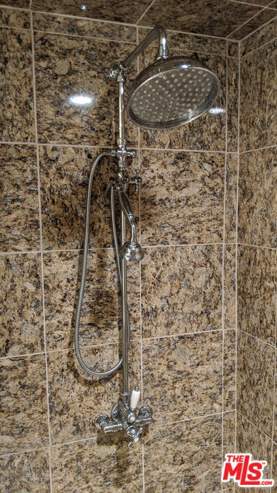 880 West 1st Street, Unit 603 Los Angeles, CA 90012 - Photo 49 of 54 a bathroom with a shower