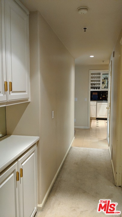 880 West 1st Street, Unit 603 Los Angeles, CA 90012 - Photo 53 of 54 a view of a hallway to the kitchen