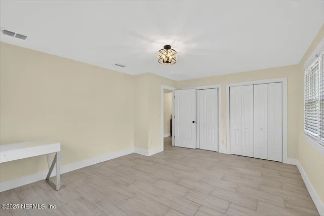 a bathroom with a shower sink and mirror