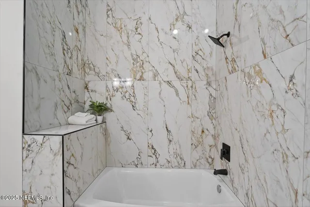 a kitchen with a refrigerator stove and microwave