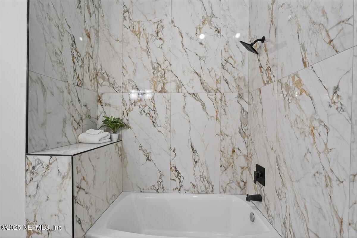 10779 Scott Mill Road Jacksonville, FL 32223 - Photo 28 of 82 a bathroom with a bathtub