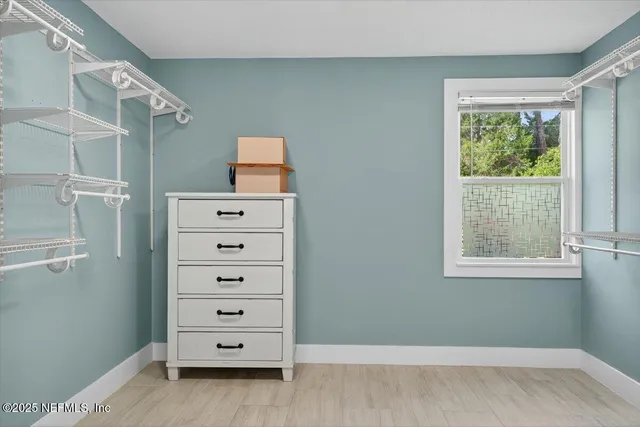 an aerial view of a house with a swimming pool