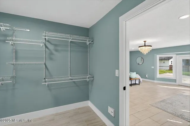 an aerial view of a house with swimming pool outdoor seating and yard