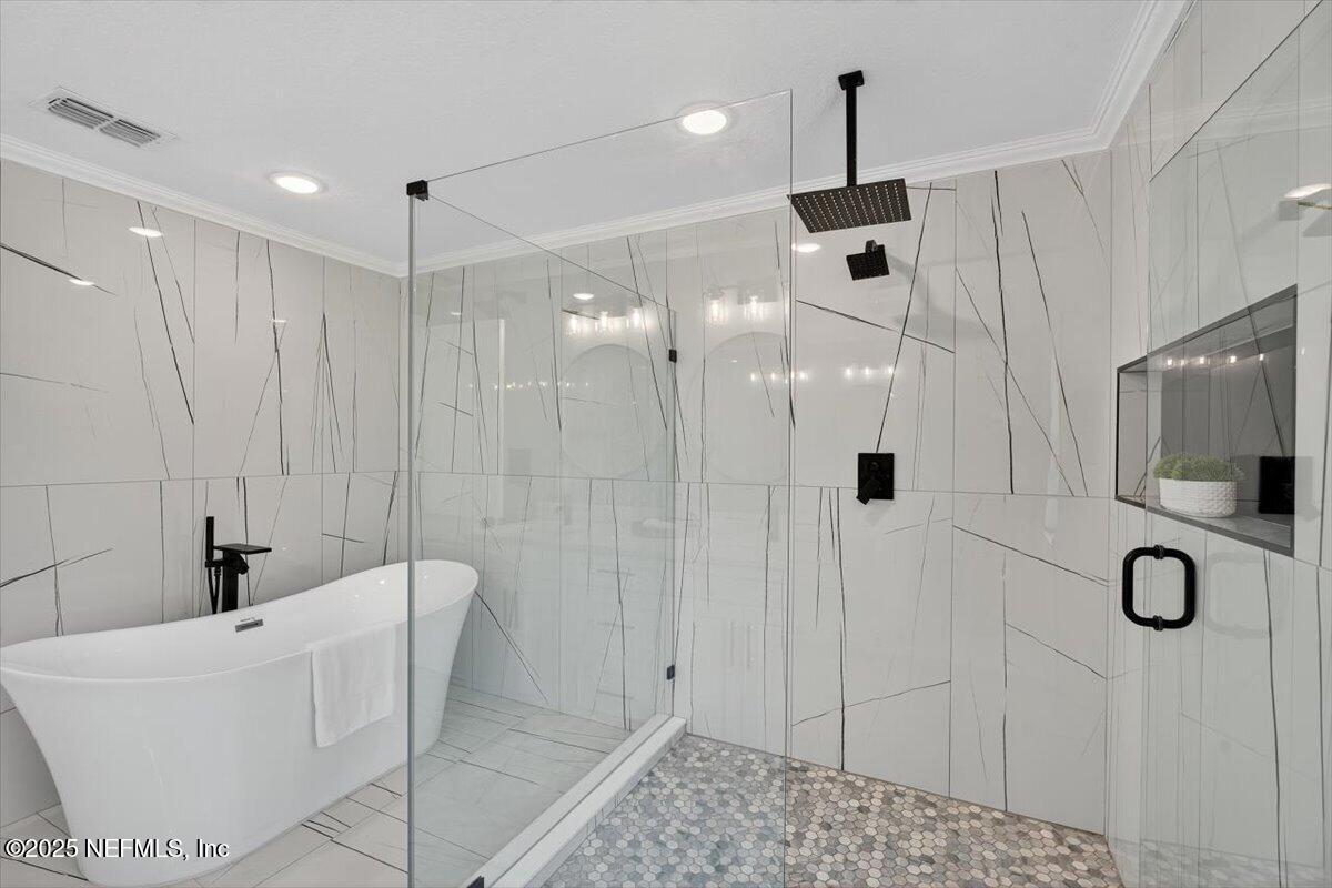 10779 Scott Mill Road Jacksonville, FL 32223 - Photo 43 of 82 a bathroom with a tub sink and mirror