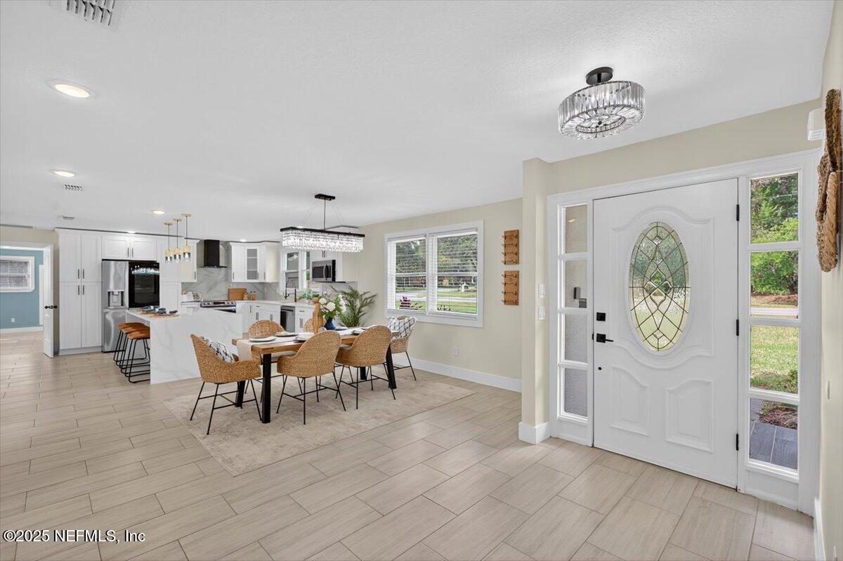 10779 Scott Mill Road Jacksonville, FL 32223 - Photo 6 of 82 a view of a livingroom with furniture window and outside view