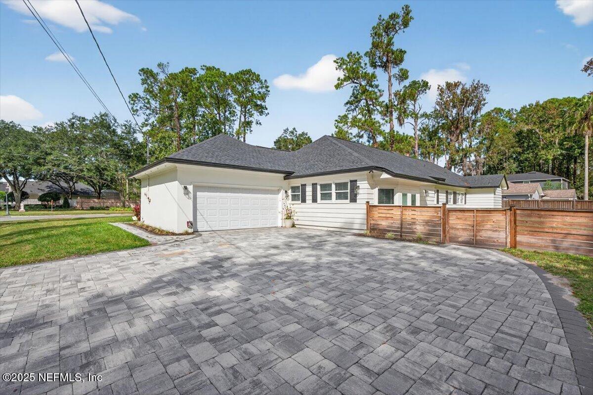 10779 Scott Mill Road Jacksonville, FL 32223 - Photo 64 of 82 a front view of a house with a yard and garage
