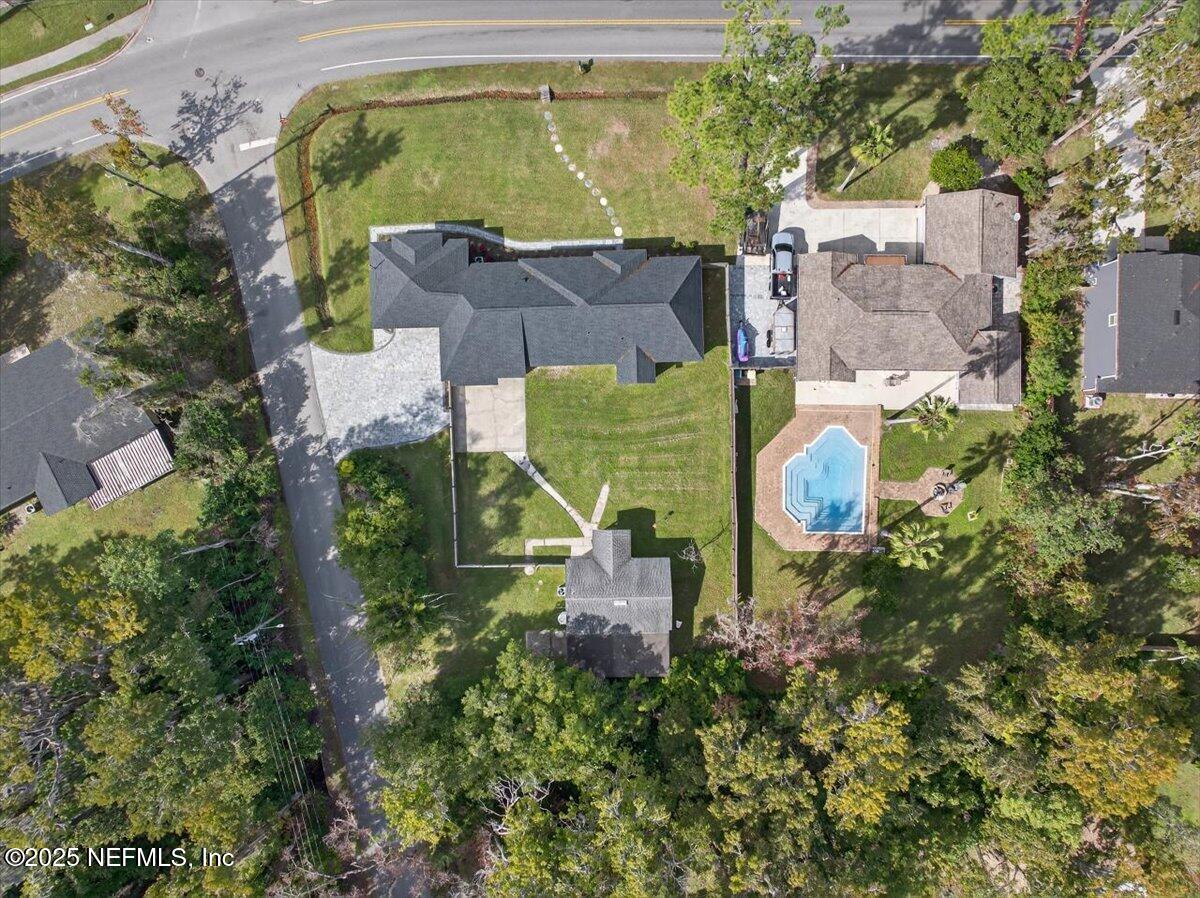 10779 Scott Mill Road Jacksonville, FL 32223 - Photo 69 of 82 an aerial view of a house with a swimming pool a yard and a garage