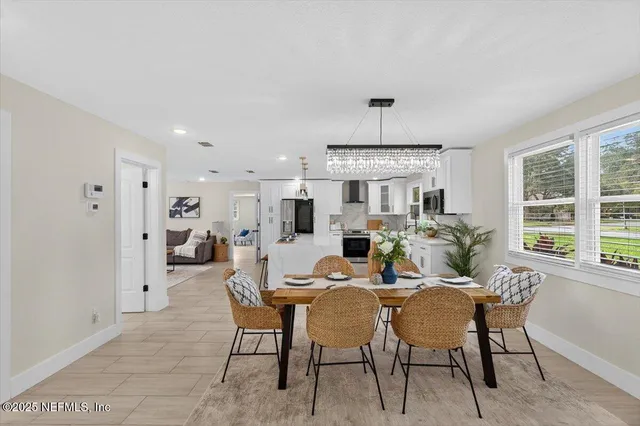 a large kitchen with lots of counter space and windows