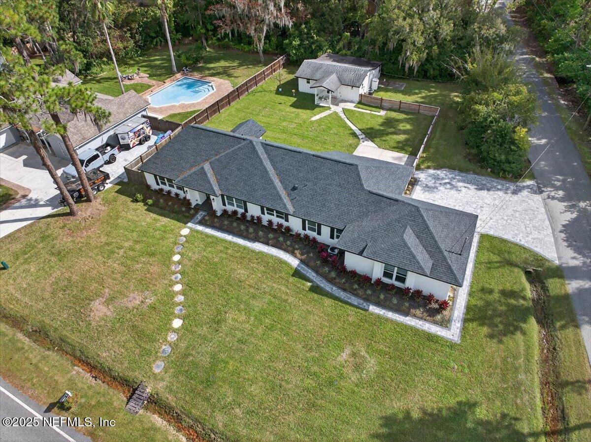 10779 Scott Mill Road Jacksonville, FL 32223 - Photo 72 of 82 an aerial view of a house with swimming pool and large trees