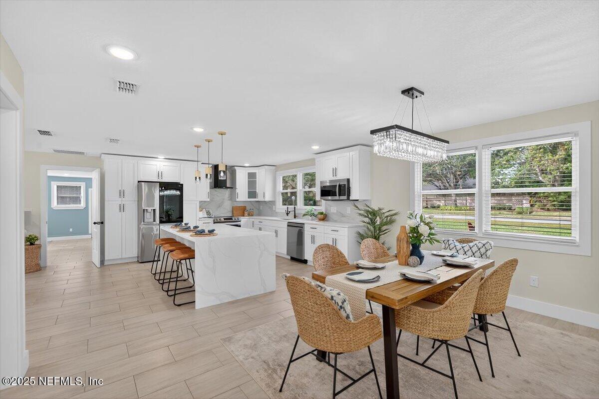 10779 Scott Mill Road Jacksonville, FL 32223 - Photo 9 of 82 a dining room with furniture and window