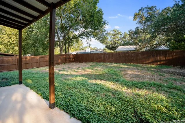 a front view of house with a garden