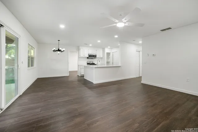 a view of a kitchen with a sink and a window