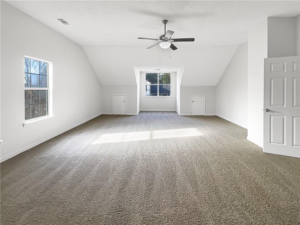 2867 Oakvale Falls Drive Decatur, GA 30034 - Photo 14 of 26 a view of a livingroom with a ceiling fan and window