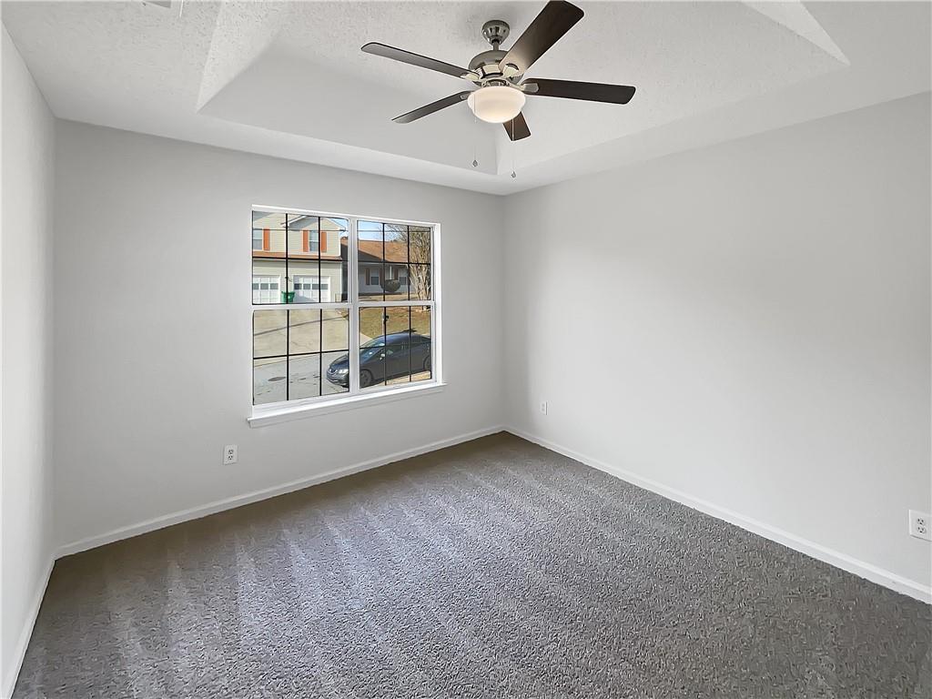 2867 Oakvale Falls Drive Decatur, GA 30034 - Photo 18 of 26 an empty room with windows and fan