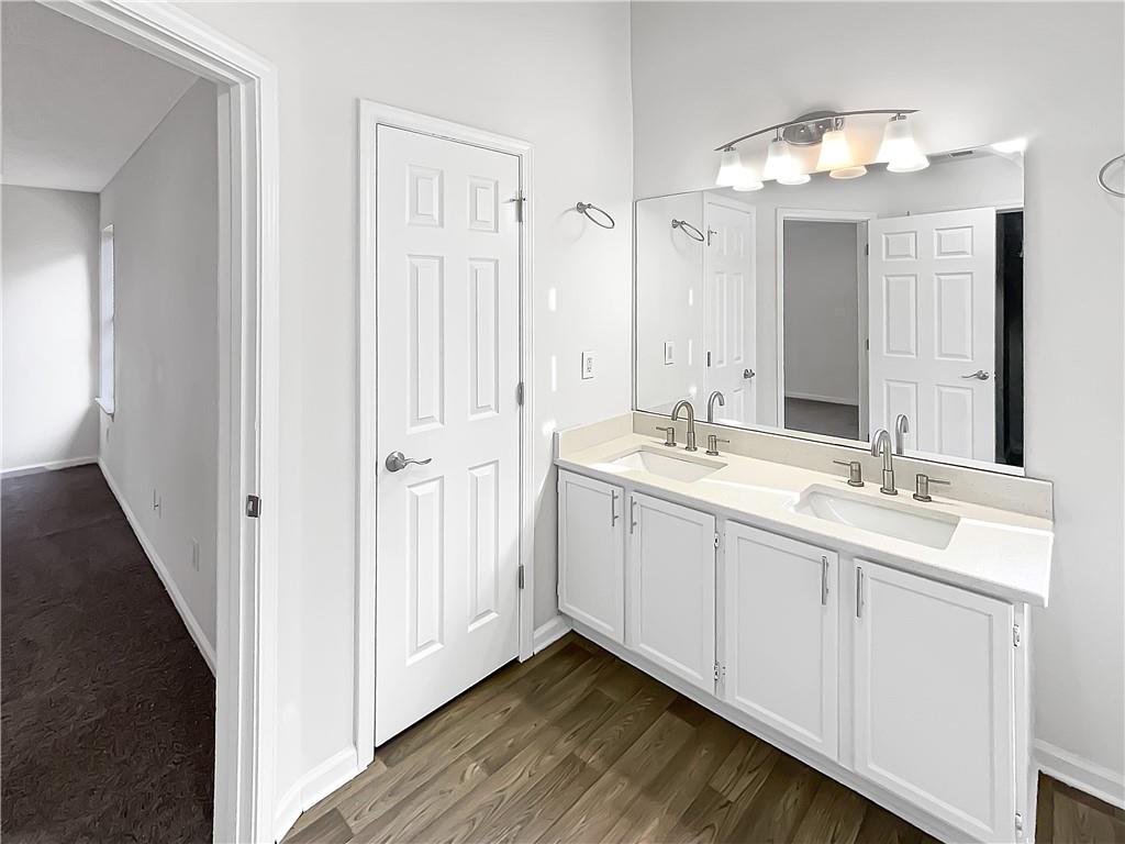 2867 Oakvale Falls Drive Decatur, GA 30034 - Photo 22 of 26 a en suite bathroom with a double vanity sink and mirror