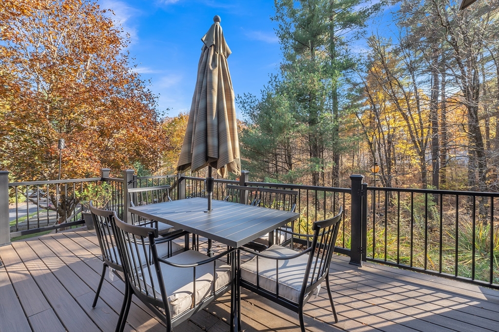 62 Coal Kiln Road Princeton, MA 01541 - Photo 12 of 41 a view of a roof deck with table and chairs and wooden floor
