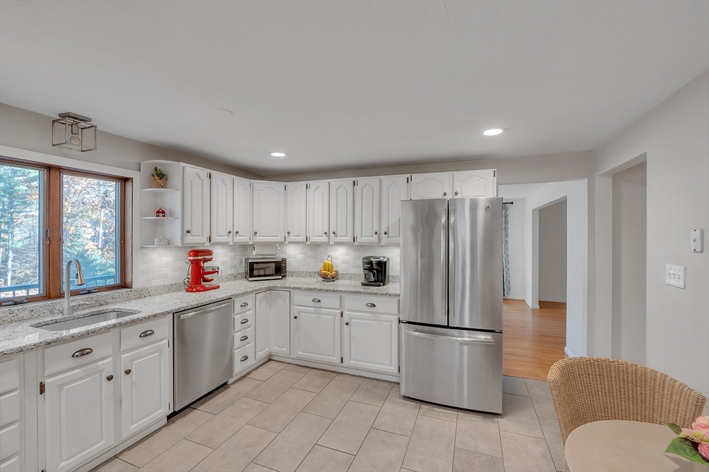 62 Coal Kiln Road Princeton, MA 01541 - Photo 14 of 41 a kitchen with stainless steel appliances a refrigerator sink and cabinets