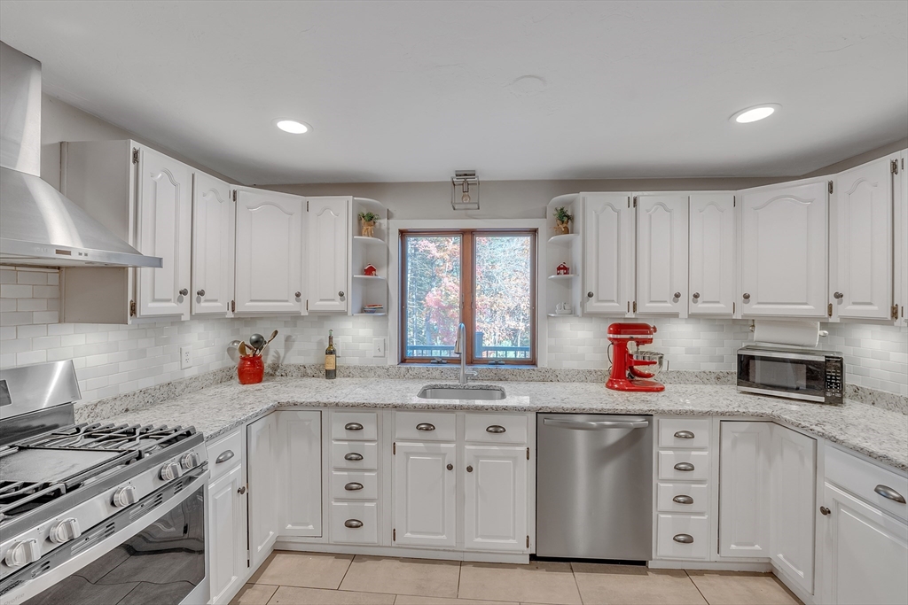 62 Coal Kiln Road Princeton, MA 01541 - Photo 15 of 41 a kitchen with white cabinets and white appliances