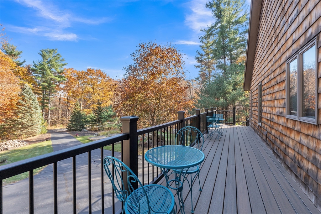 62 Coal Kiln Road Princeton, MA 01541 - Photo 16 of 41 a view of a balcony with wooden floor and outdoor seating
