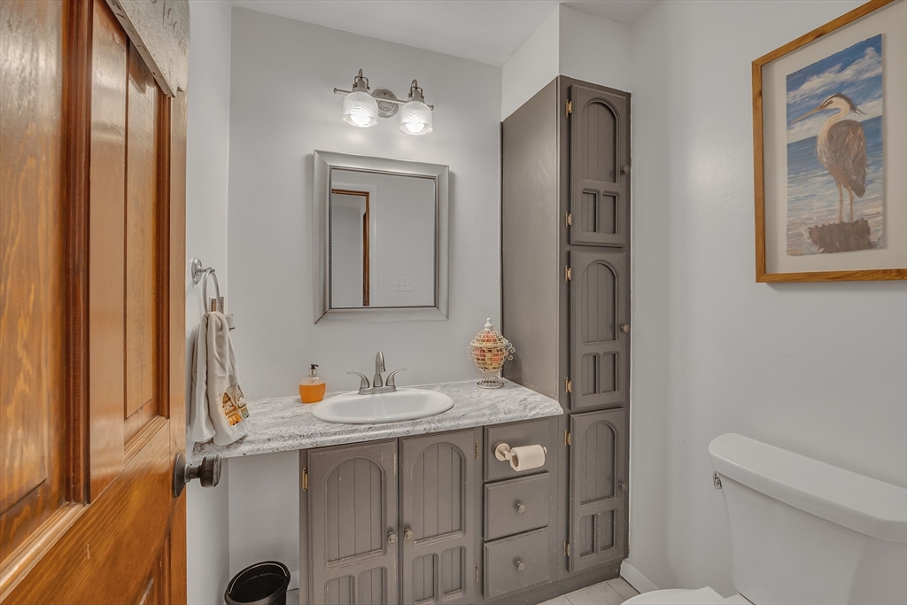 62 Coal Kiln Road Princeton, MA 01541 - Photo 17 of 41 a bathroom with a sink a toilet and mirror