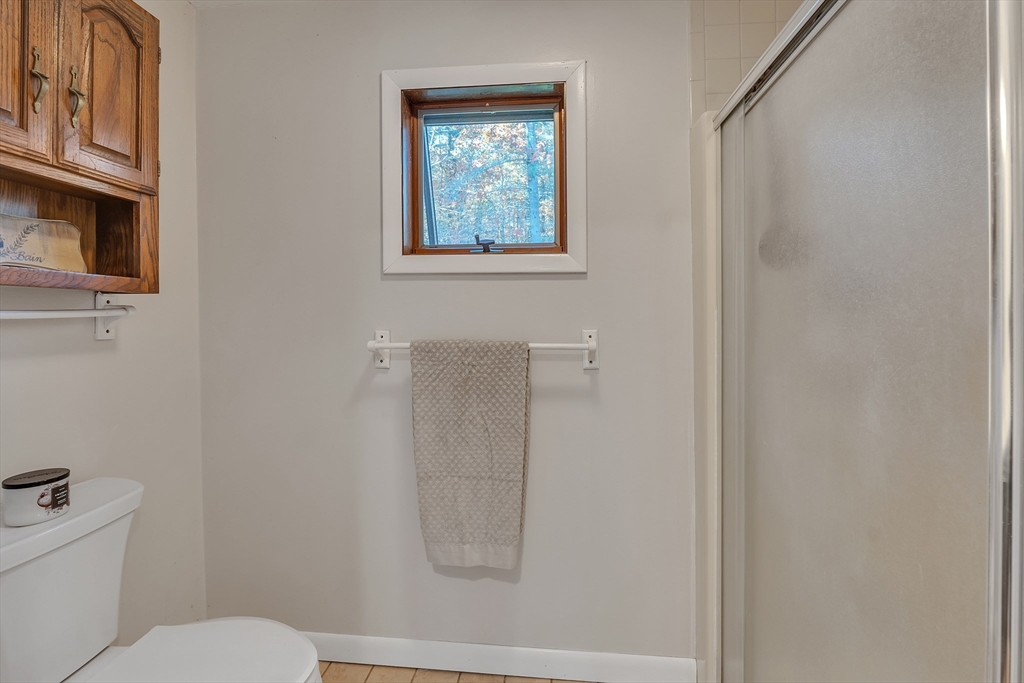 62 Coal Kiln Road Princeton, MA 01541 - Photo 23 of 41 a white toilet sitting next to a bathroom sink