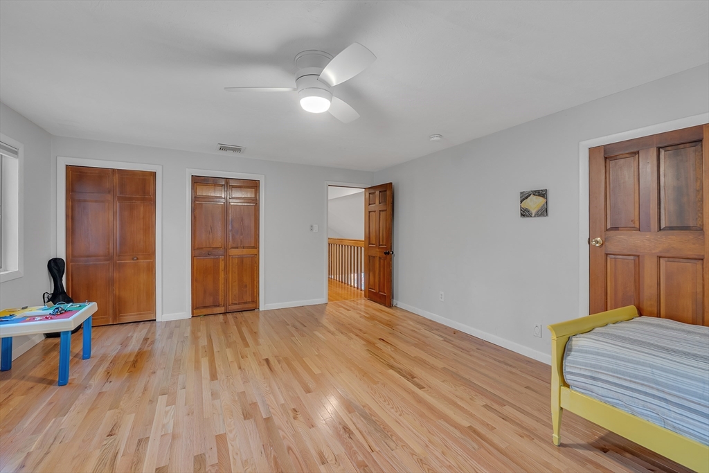 62 Coal Kiln Road Princeton, MA 01541 - Photo 25 of 41 a bedroom with a bed and wooden floor