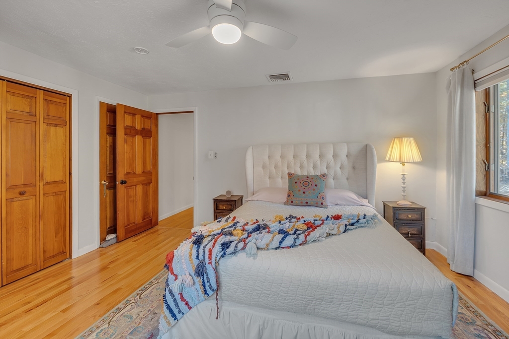 62 Coal Kiln Road Princeton, MA 01541 - Photo 29 of 41 a bedroom with a bed and a lamp