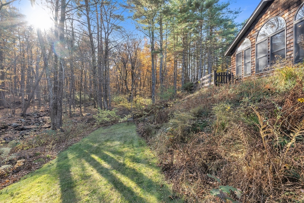 62 Coal Kiln Road Princeton, MA 01541 - Photo 36 of 41 a view of a yard with plants and large trees