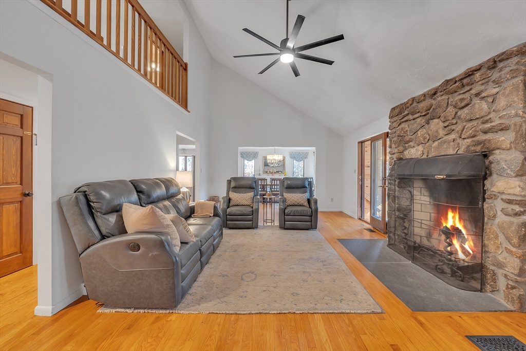 62 Coal Kiln Road Princeton, MA 01541 - Photo 6 of 41 a living room with furniture and a fireplace