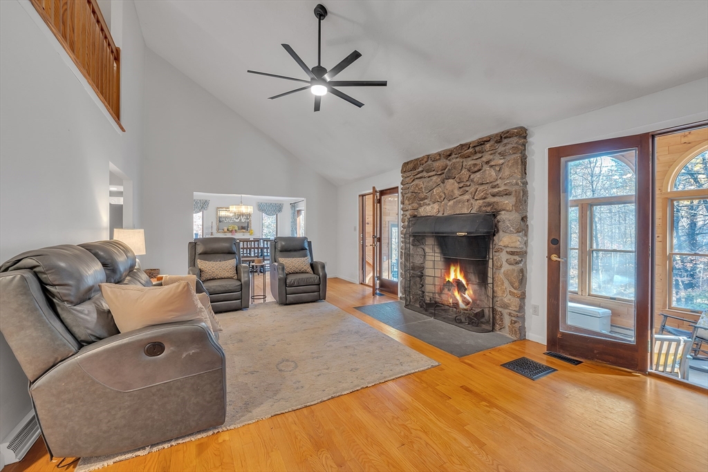 62 Coal Kiln Road Princeton, MA 01541 - Photo 7 of 41 a living room with furniture and a fireplace