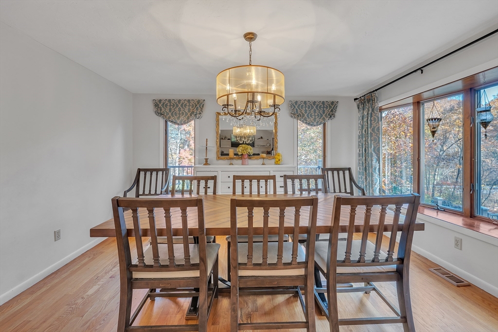 62 Coal Kiln Road Princeton, MA 01541 - Photo 9 of 41 a view of a dining room with furniture window and wooden floor