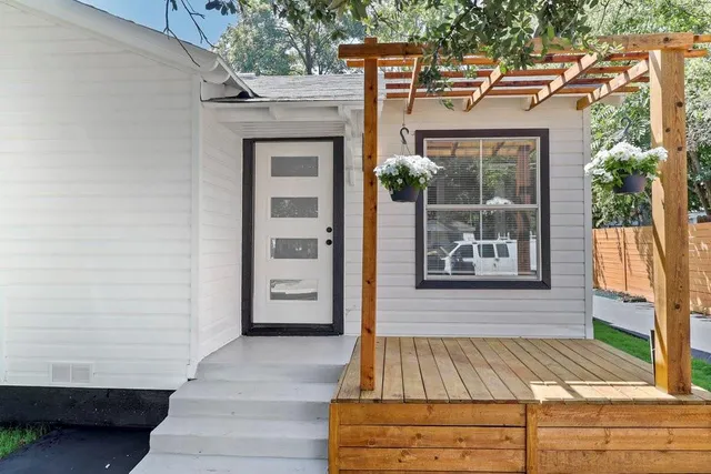 a view of a door with a door and wooden floor