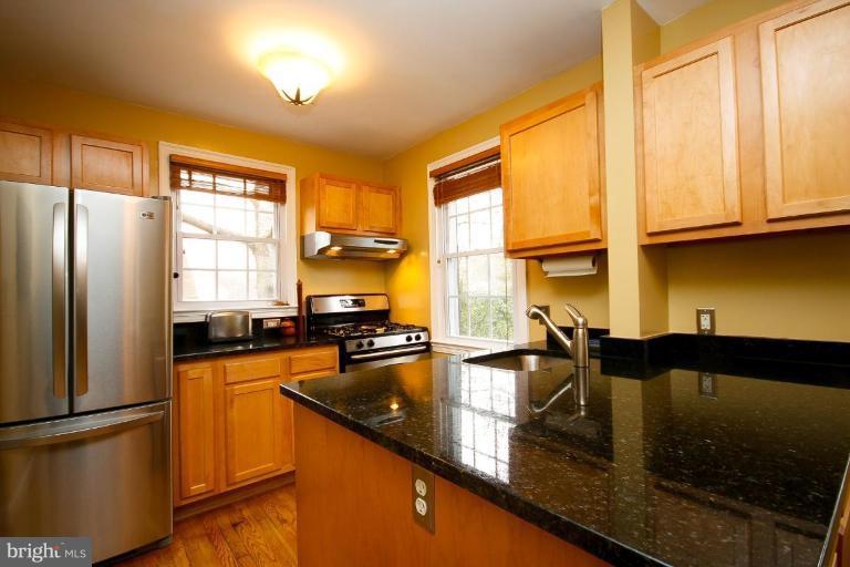 Updated kitchen with granite counters and ss appl.