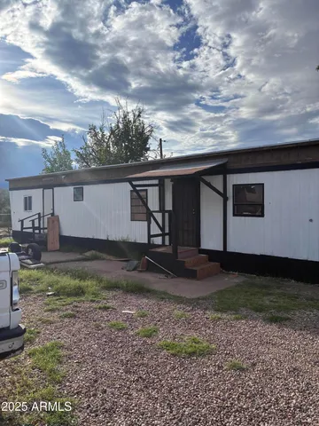 a view of a backyard with plants and a lake