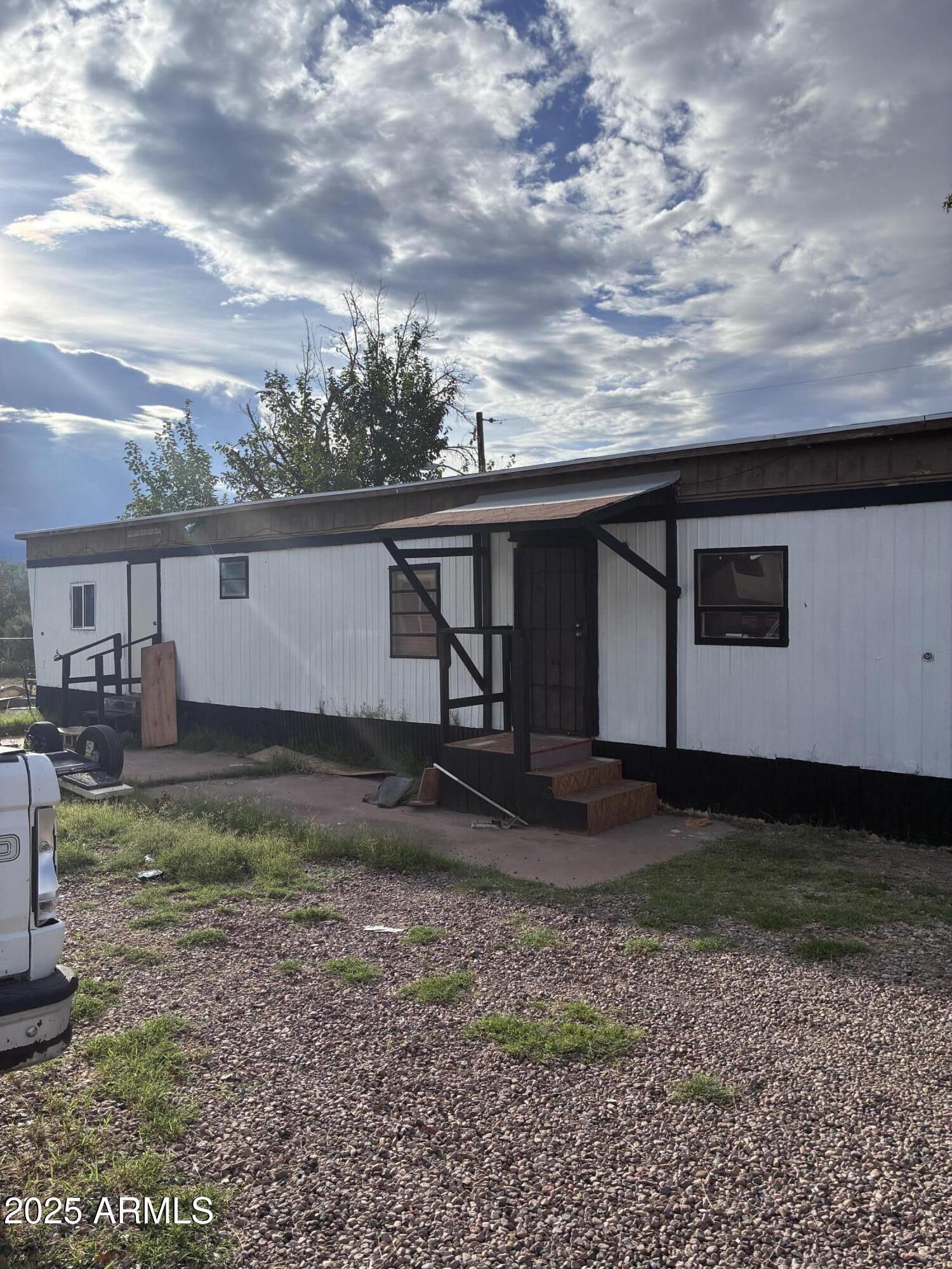 a view of a backyard with plants and a lake